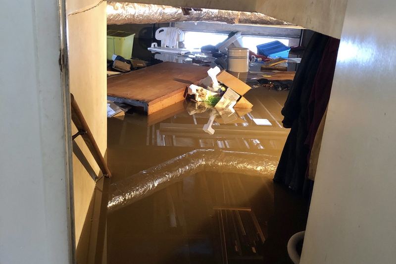 Flooded residential basement with standing water
